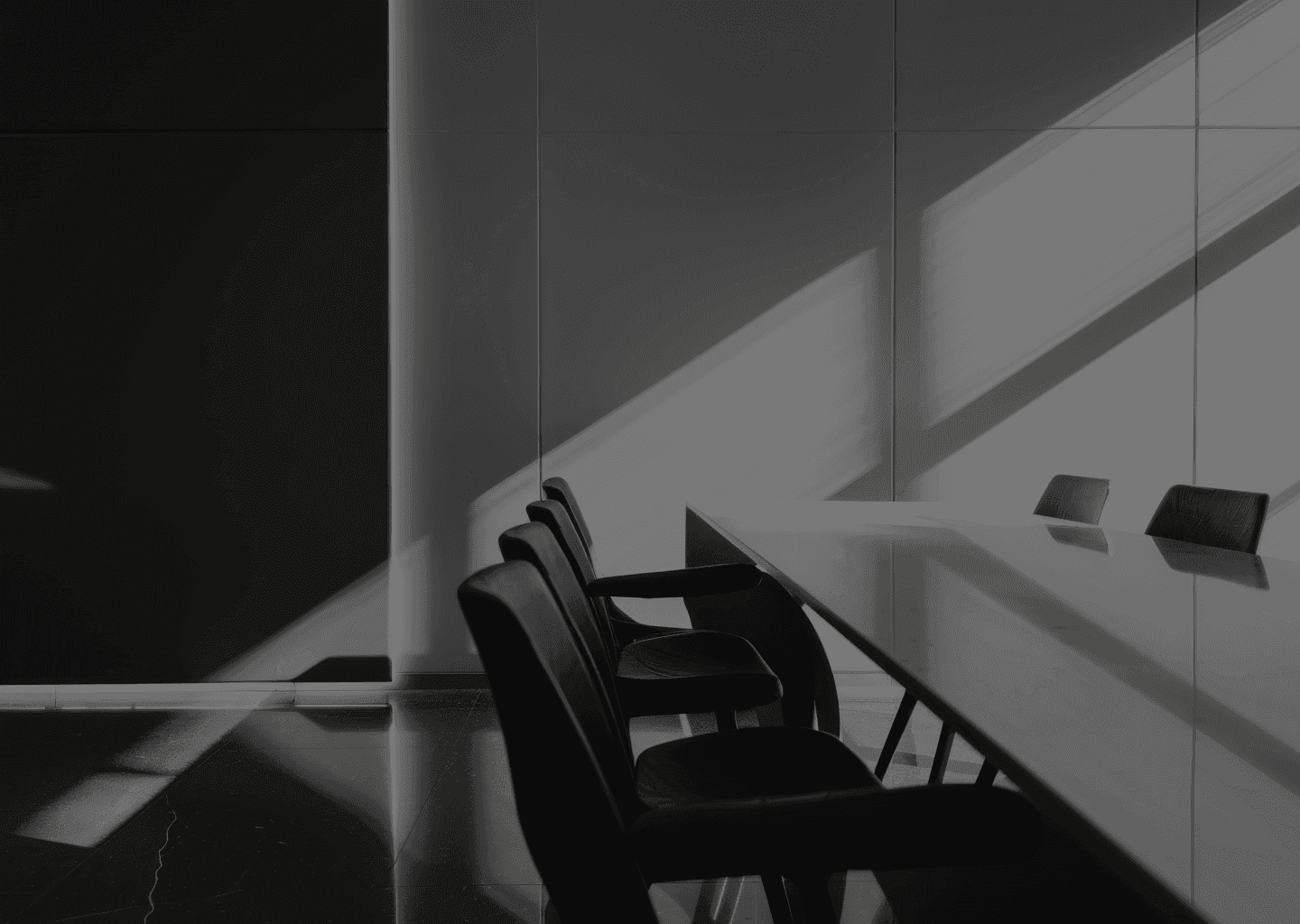 A photo of an empty courthouse room with a table and chairs