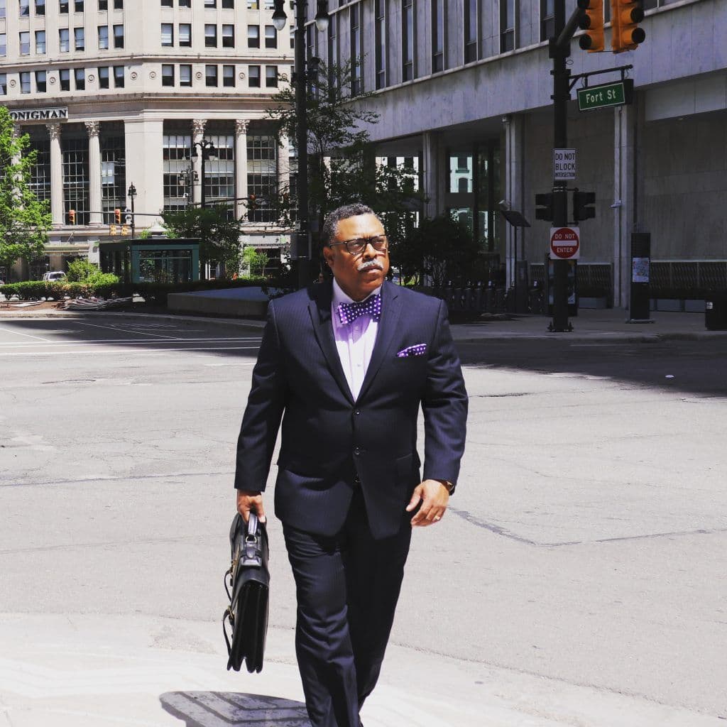 Attorney Arnold Reed walking down Fort Street in Detroit, Michigan towards the courthouse