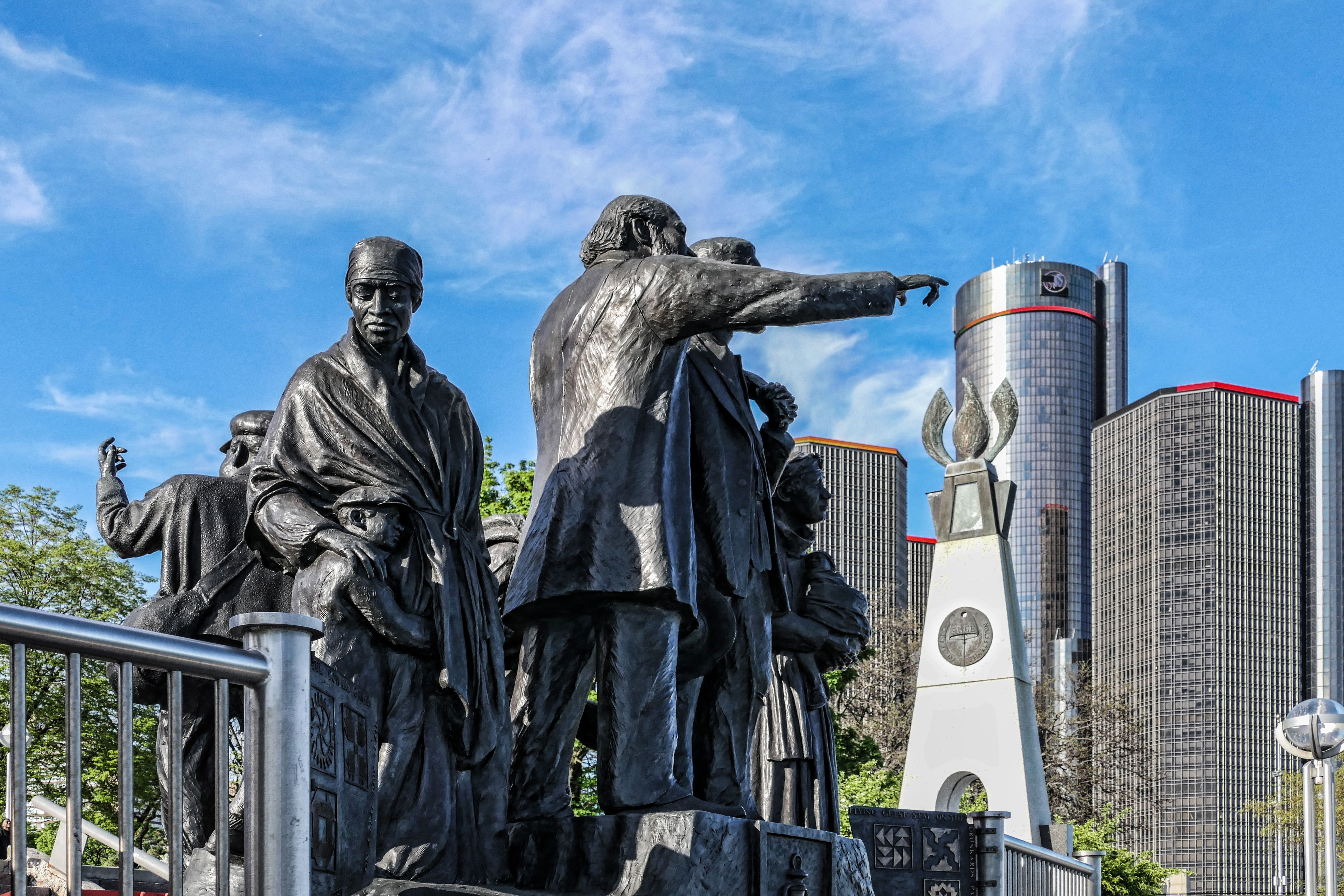 Gateway to Freedom statue with the Detroit skyline in the background